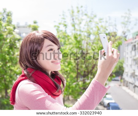 Young beautiful woman wearing winter clothing and photo selfie, asian beauty