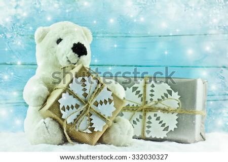 Teddy bear with Christmas gift.