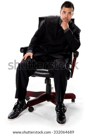 Serious Asian man with short black hair in business formal outfit with hands on thighs - Isolated