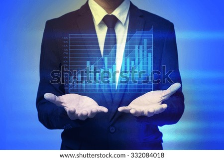 Close up of businessman holding graph in palms