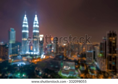 Blurred image of Kuala Lumpur city skyline at night