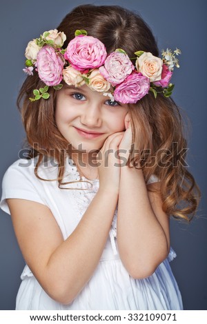 Beautiful child wearing a flower wreath 