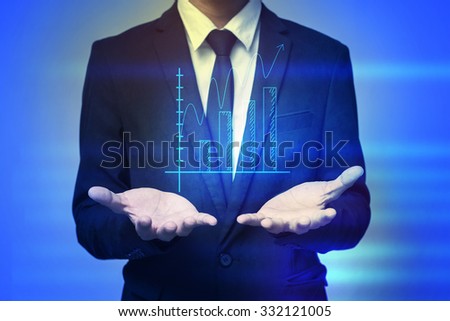 Close up of businessman holding graph in palms