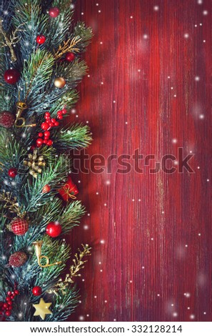 Old grunge red wooden board with Christmas border and copy space for text. Christmas card.