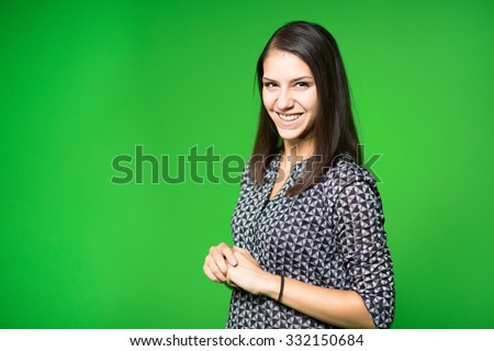  TV weather news reporter at work.News anchor presenting the world weather report.Television presenter recording in a green screen studio.Young woman with copy space on green screen chroma key