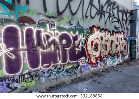 Beautiful street art of graffiti. Abstract color creative drawing fashion on the walls of the city. Urban contemporary culture. Title paint on the walls. Culture youth protest