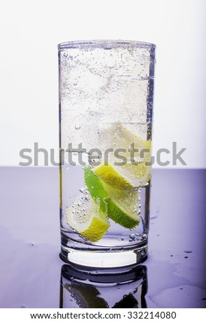 Soda with lemon and lime in the glass