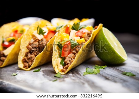 Mexican food - delicious tacos with ground beef Royalty-Free Stock Photo #332216495