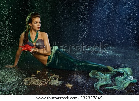 Young beautiful  girl at the image of mermaid