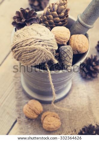 toys for the Christmas tree , Walnut, pine cones on old wooden background.Christmas. Christmas time. Pine cones   Wooden background. toning