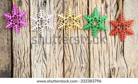 Old grunge wooden board with Christmas border.