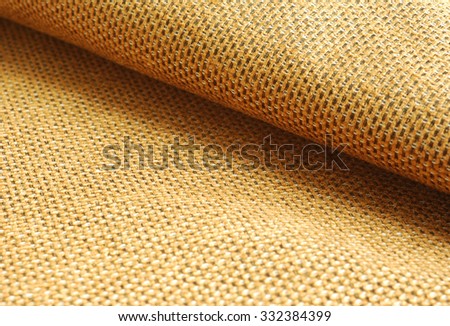 Reddish yellow Chenille fabric waved textile background. Royalty-Free Stock Photo #332384399
