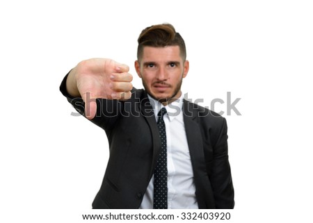 Businessman looking sad and showing thumb down