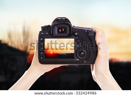 Photographer with camera at work