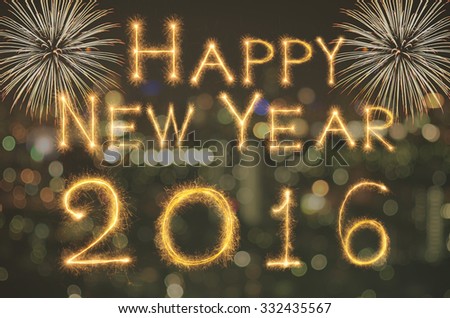 Happy new year 2016 written with Sparkle firework on photo blurred bokeh background