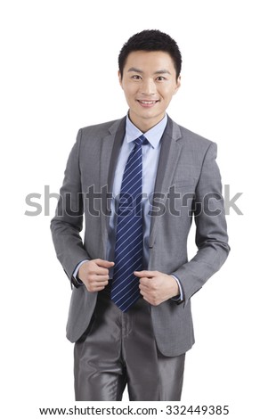 Portrait of young businessman standing in white background