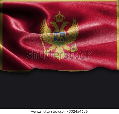 Montenegro flag on smooth silk texture Dark Background Space for Text