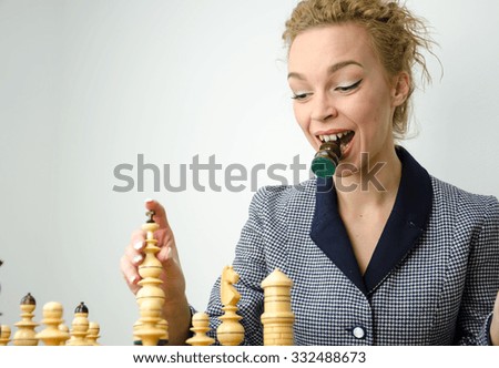 Business woman play chess and think about move