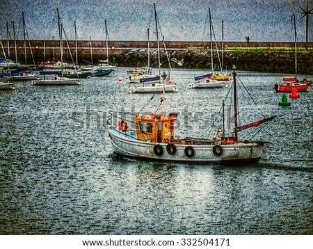 Small fishing boat sailing through harbour with yachts in background