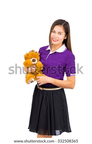 Asian woman holding a teddy bear on a white background.