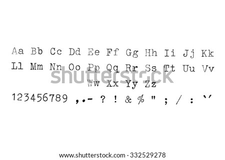 Vintage typewriter machine typeset alphabet, numbers and symbols on white paper.