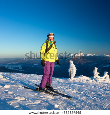 Happy woman in Mountains ski resort - nature and sport picture 