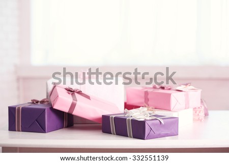 Cute gift boxes on white table