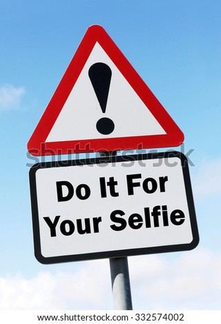 A red and white triangular road sign with a Do It For Your Selfie play on words concept against a partly cloudy sky.