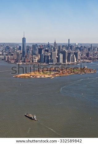 Aerial view of Manhattan with Governors Island in the foreground, New York, USA. Located in Upper New York Bay, Governors Island is home to historical fortifications Fort Jay and Castle Williams