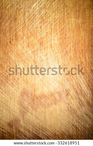 Old worn out cutting board with flour and dough residues. Background texture. Toned.