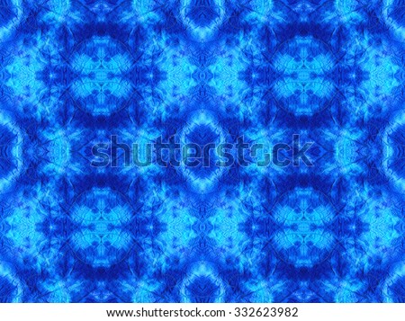 Hand-dyed blue and turquoise fabric with zigzag stitch detail and in a seamless repeat pattern. Dying was done using cold water dyes. Royalty-Free Stock Photo #332623982