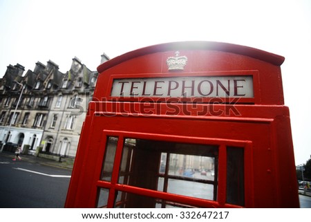 Color image of a vintage red London telephone booth.