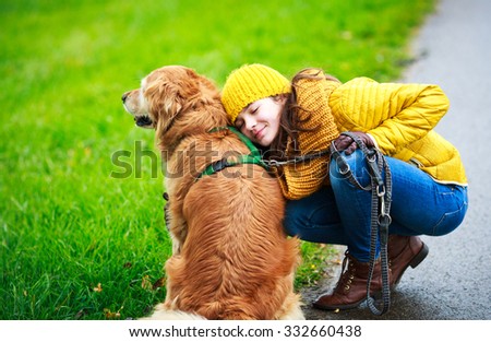 friendship between a little girl and dog Royalty-Free Stock Photo #332660438