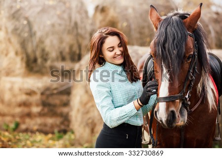 Portrait of Young woman and brown Horse Royalty-Free Stock Photo #332730869