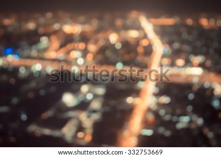 vintage tone blur image of Abstract city bokeh light background