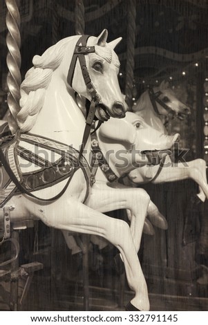 White horse in a carousel at the fair.  Cross processed and texture to look like and instant picture.