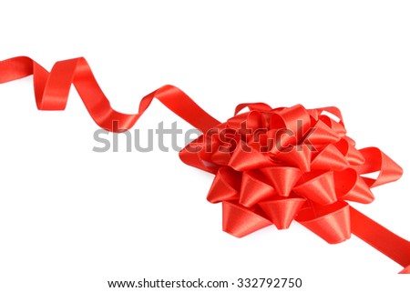 Red bow with curved ribbon isolated on white background