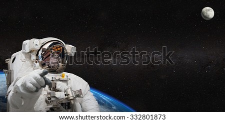 Astronaut on space mission. Elements of this image furnished by NASA.