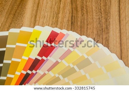 color palette guide on wooden board close up view