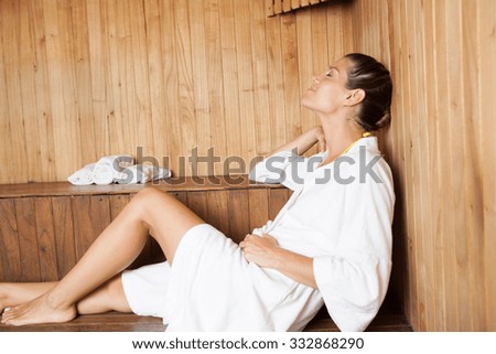 Woman relaxing in the sauna