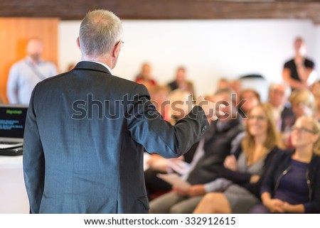 Business man leading a business workshop. Corporate executive delivering a presentation to his colleagues during meeting or in-house business training. Business and entrepreneurship concept. Royalty-Free Stock Photo #332912615
