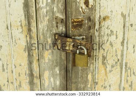 Old lock on the door - lock on the door of an old house