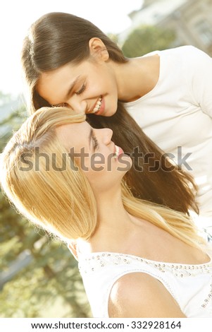 Best memories. Vertical shot of happy mother and daughter laughing together 