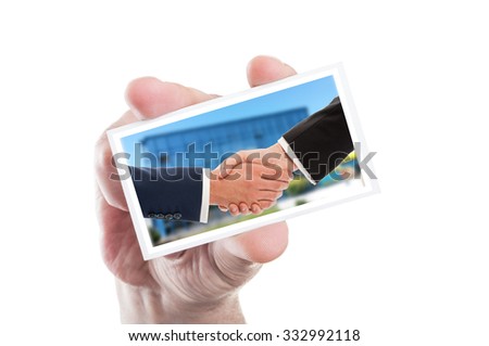 Business handshake concept on card hold by male hand isolated on white background