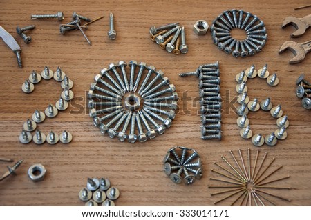 Happy new year 2016 composition with  nails bolts and dowels