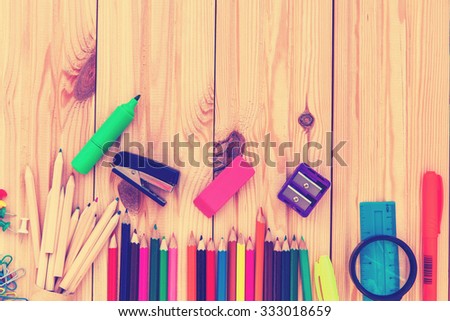 school objects isolated on a wooden background