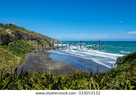 Maori Bay in Muriwai Regional Park,it is on the West Coast of the North Island in Auckland,New Zealand Royalty-Free Stock Photo #333053132