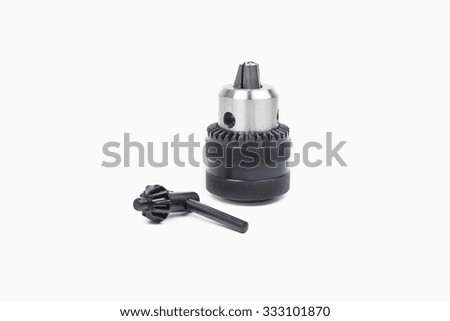 Steel drill for drilling holes in wood and metal on white background.
