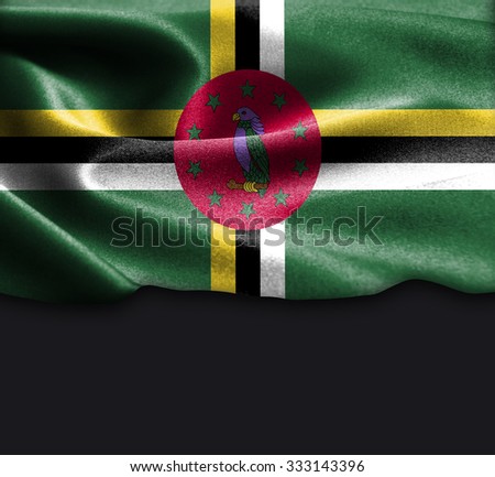 Dominica flag on smooth silk texture Dark Background Space for Text