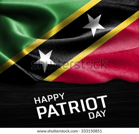 Happy Patriot Day Saint Kitts and Nevis flag on wood Texture background